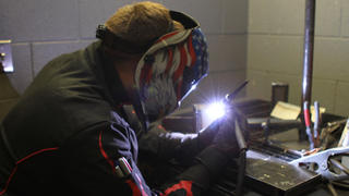 A welding student at Lincoln Tech's Denver campus trains with an ARC welder