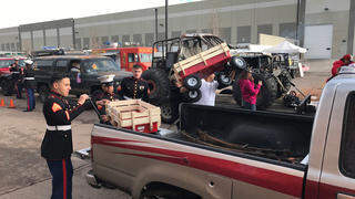 US Marines from Marine Air Control Squadron 23 loading up toys for kids