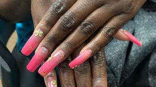 nail extensions with decorative art work. 