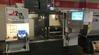 The VF2TR shown is a Haas Vertical Milling Center