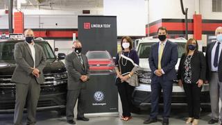 Representatives of both Volkswagen of America and Lincoln Tech meet to accept two new VW Atlas vehicles into the Lincoln Tech training fleet.